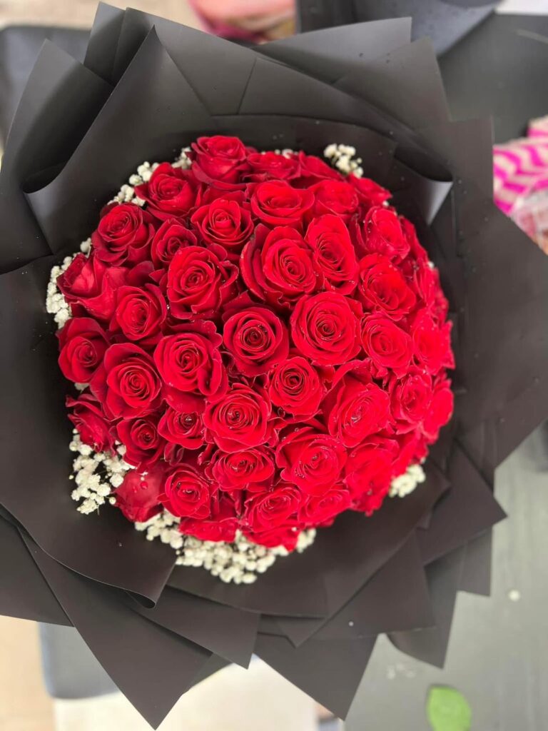 Premium Colombian Red Rose Bouquet Make a lasting impression with our stunning Colombian Red Rose Bouquet, featuring premium long-stem roses renowned for their exceptional beauty, vibrant color, and large, luxurious blooms. Carefully hand-tied by our expert florists, this elegant bouquet is a timeless expression of love, passion, and admiration. Whether you’re celebrating an anniversary, birthday, Valentine’s Day, or simply want to surprise someone special, these exquisite roses create a memorable gift that speaks from the heart. Features • Premium Colombian long-stem red roses • Large, velvety blooms with rich red color • Expertly hand-crafted and beautifully wrapped • Symbol of love, romance, and appreciation • Perfect for anniversaries, birthdays, and special occasions A classic bouquet designed to make every moment unforgettable.