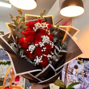 Product Title: Classic Red Rose Bouquet Product Description: Celebrate love, romance, and heartfelt emotions with this elegant Classic Red Rose Bouquet. Featuring premium fresh red roses beautifully wrapped in stylish black and white paper, this bouquet is accented with delicate baby’s breath and seasonal greenery for a timeless and sophisticated look. Red roses are the ultimate symbol of love, passion, admiration, and devotion, making this bouquet the perfect gift for anniversaries, birthdays, Valentine’s Day, romantic occasions, or simply to show someone how much they mean to you. Handcrafted by our experienced florists, each bouquet is carefully arranged to create a memorable and meaningful gift that leaves a lasting impression. Features: * Premium fresh red roses * Elegant baby’s breath accents * Stylish luxury wrapping * Handcrafted by professional florists * Fresh and beautifully presented Perfect For: * Romantic gifts * Anniversaries * Valentine’s Day * Birthdays * Marriage proposals * Special celebrations Flower Meaning: Red roses symbolize deep love, passion, respect, and commitment, making this bouquet a timeless expression of your feelings. ❤️ A classic bouquet that speaks the language of love without saying a word.